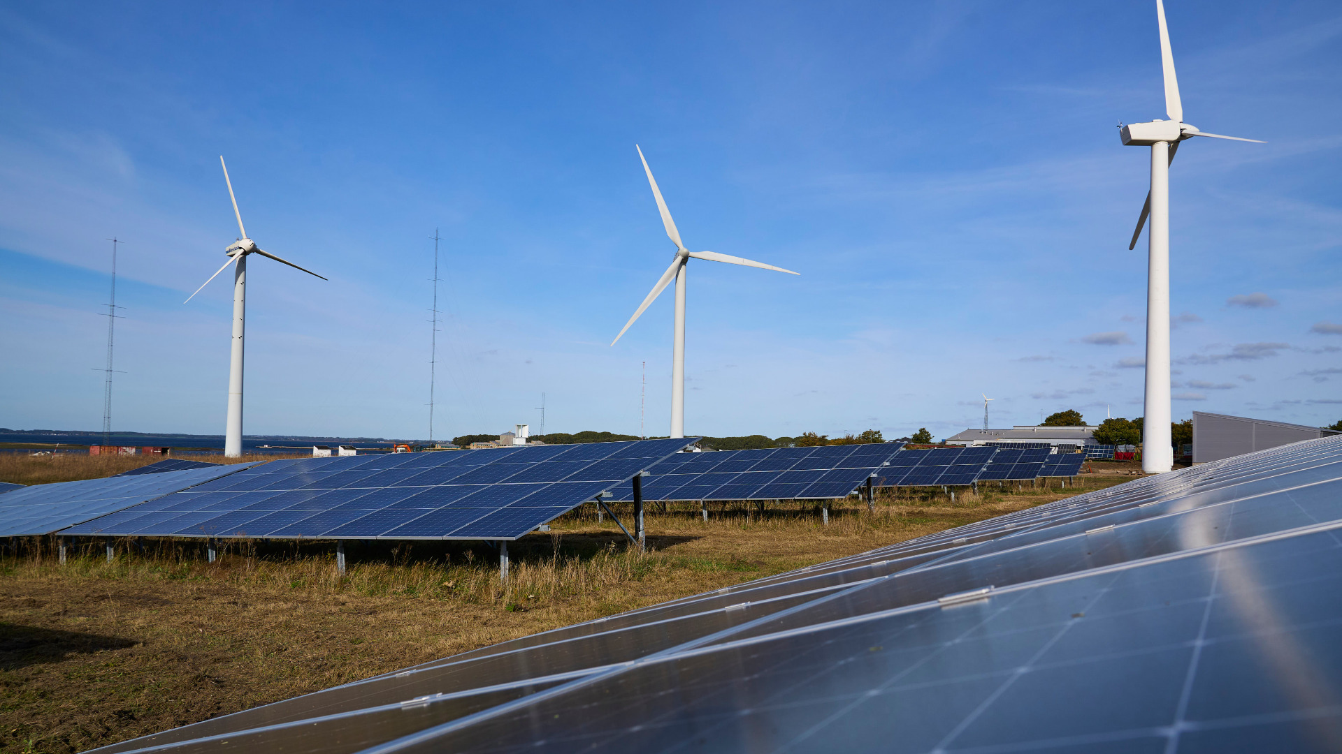 A couple of wind turbines and solar panels. Photo: Andreas Bro