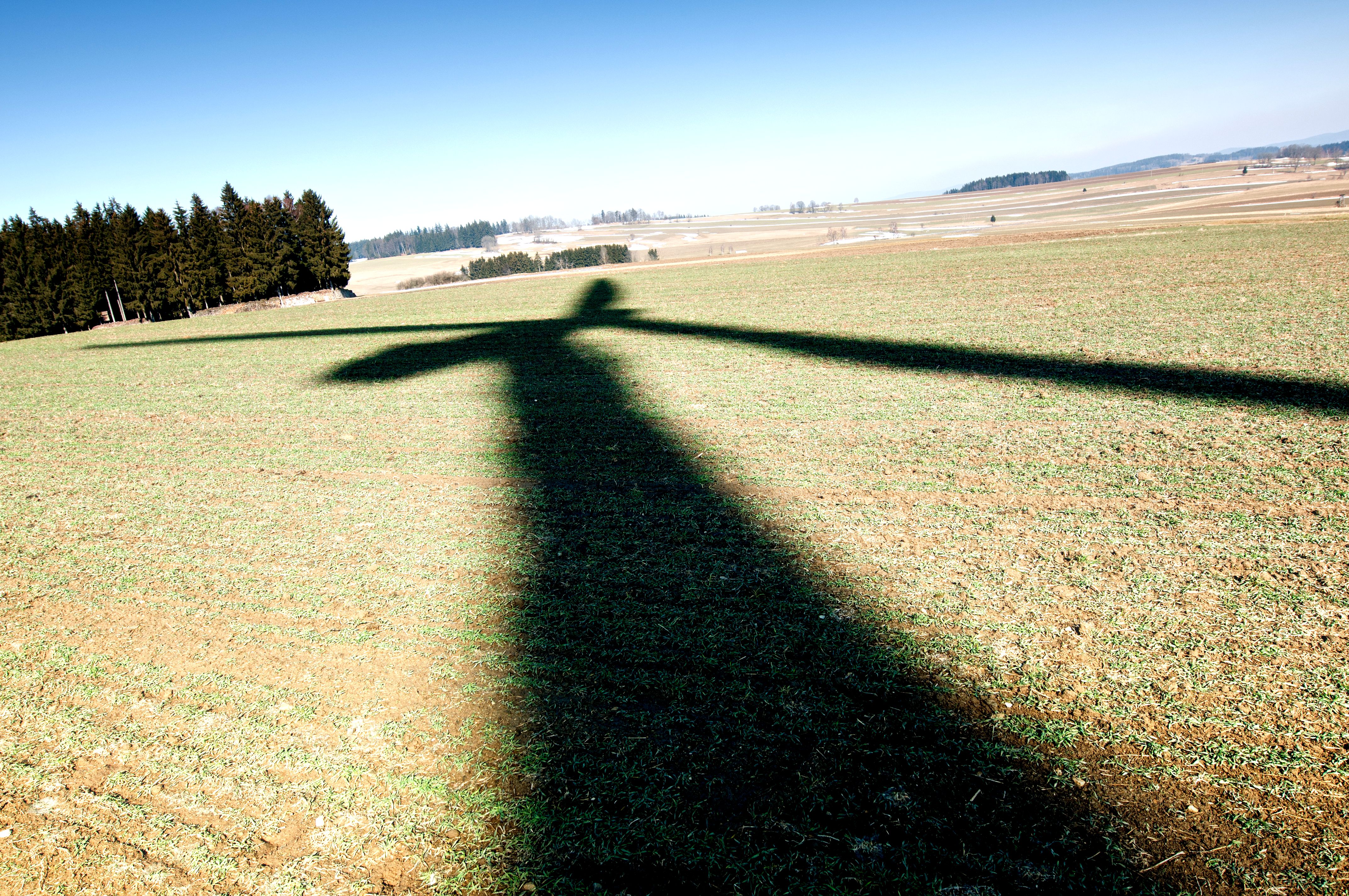 Photo of a wind turbine throwing shade