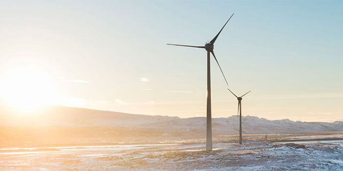 Picture of two wind turbines in a cold climate